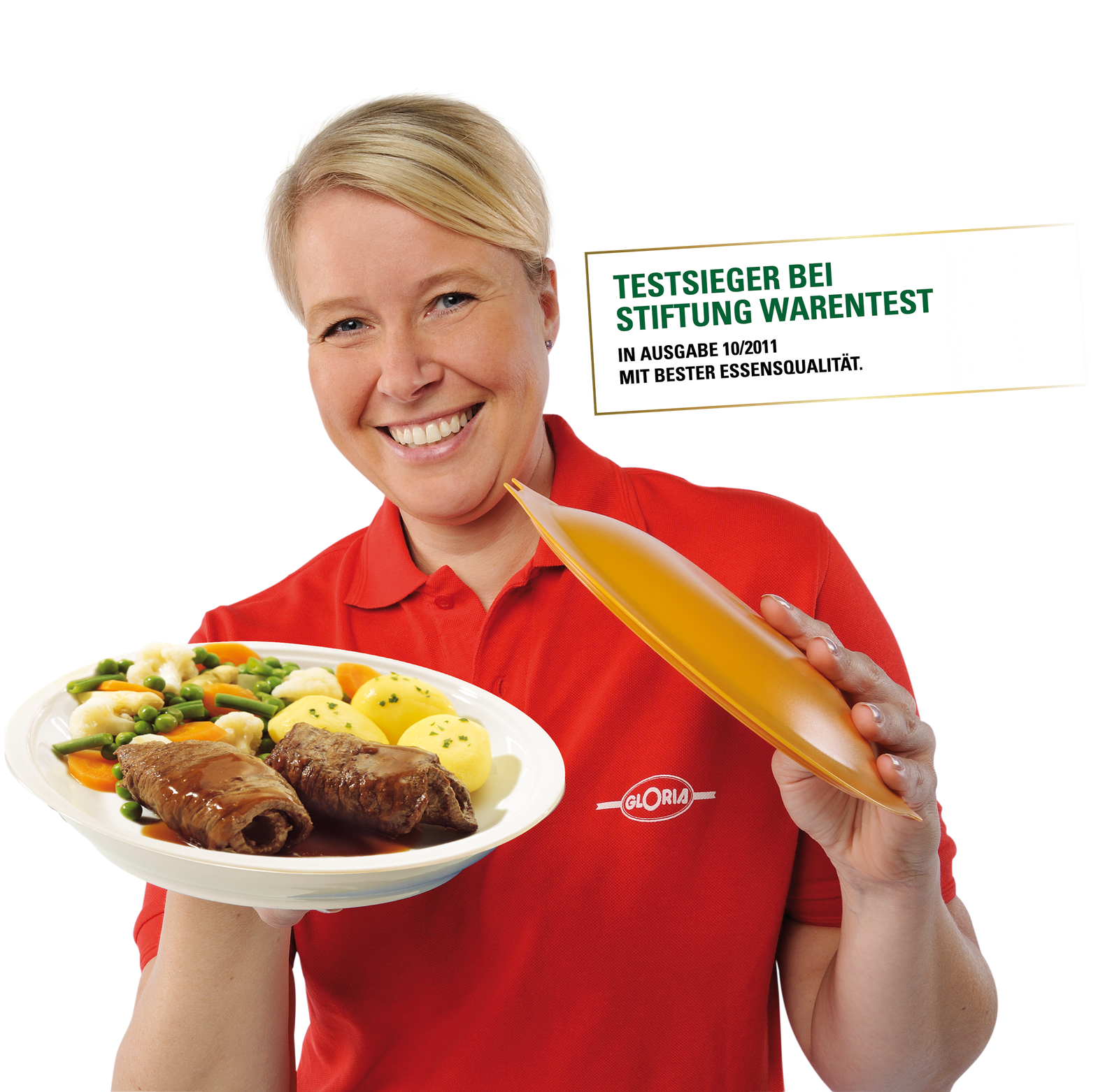 Mitarbeiterin von Gloria präsentiert ein Gericht mit Rouladen, Kartoffeln und Gemüse – ausgezeichnet als Testsieger bei Stiftung Warentest 10/2011.